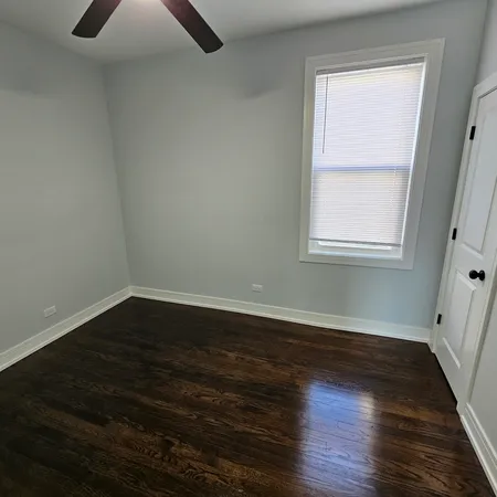 a living room with a furniture and a wooden floor