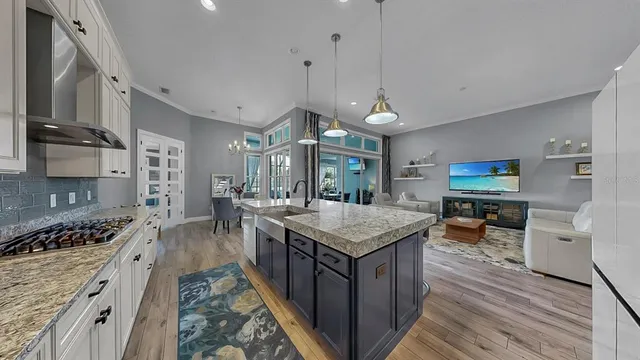 a kitchen with stainless steel appliances granite countertop a stove and a refrigerator