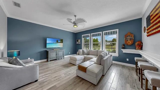 a living room with furniture and a large window