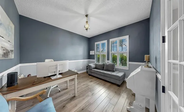 a bathroom with a granite countertop sink a toilet and a bathtub