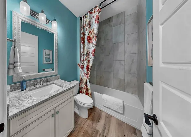 a bathroom with a sink and toilet