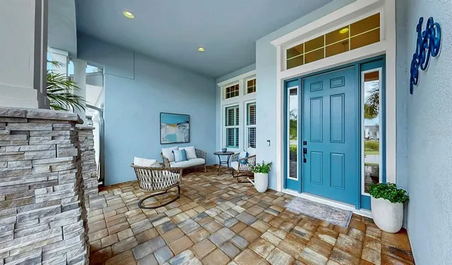 a view of a patio with table and chairs
