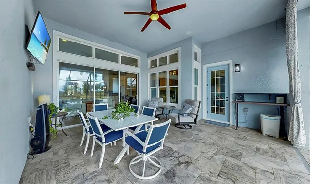 a view of a swimming pool with a patio