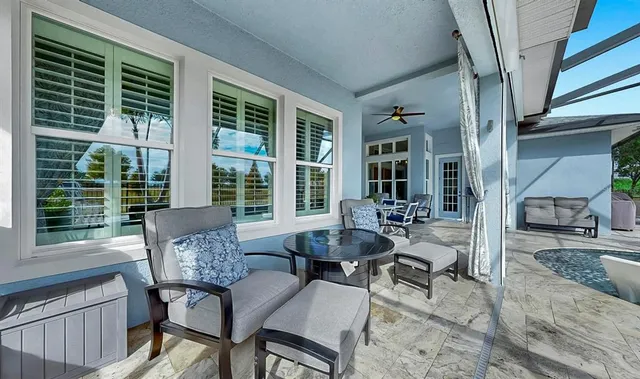 a view of a swimming pool with a patio