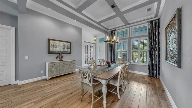 a dining room with furniture and window