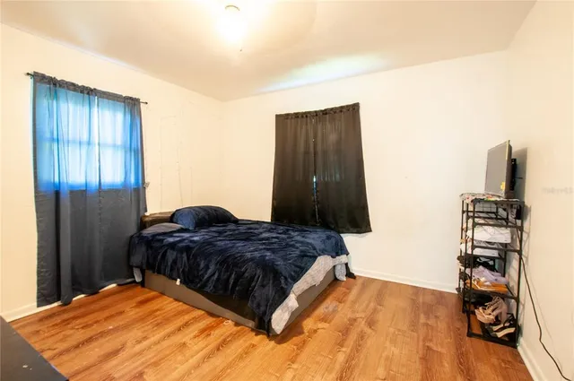 a bedroom with a bed and a view of bathroom