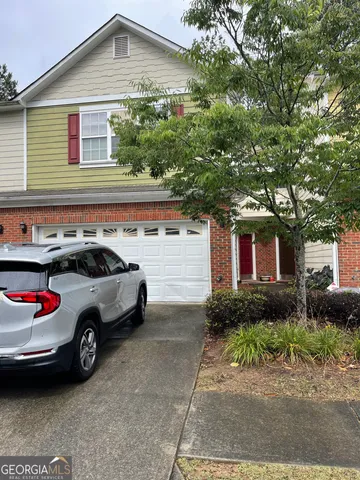 a front view of a house with garage