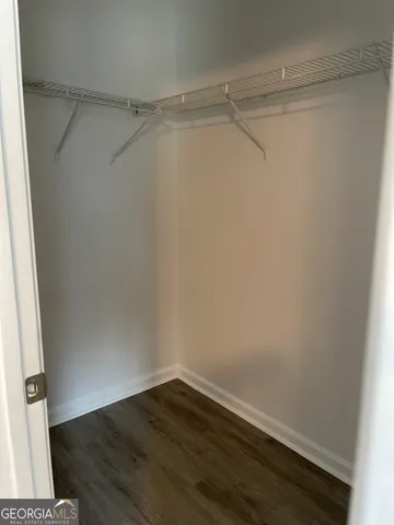 a view of an empty walk in closet