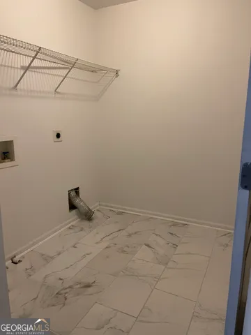 a view of a room with racks on the wall