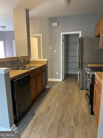 a view of a kitchen from a dining room
