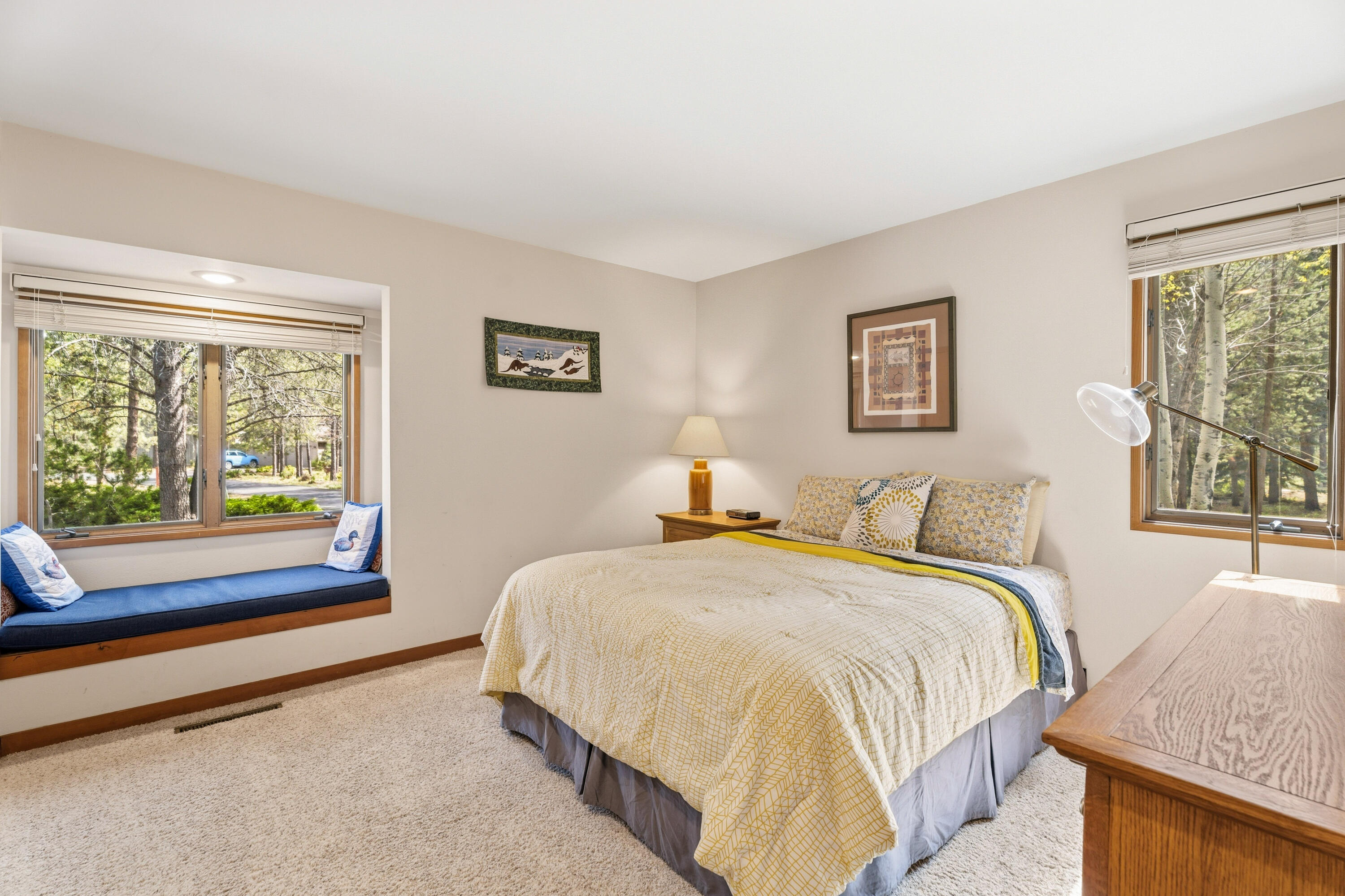 17866 Grouse Lane, Unit 3 Sunriver, OR 97707 - Photo 28 of 61 a bedroom with a bed and a large window with outer view