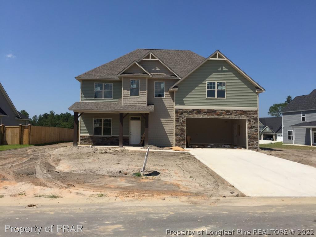 4778 McKinnon Farm Road Fayetteville, NC 28304 - Photo 1 of 18 a front view of a house with yard and parking space