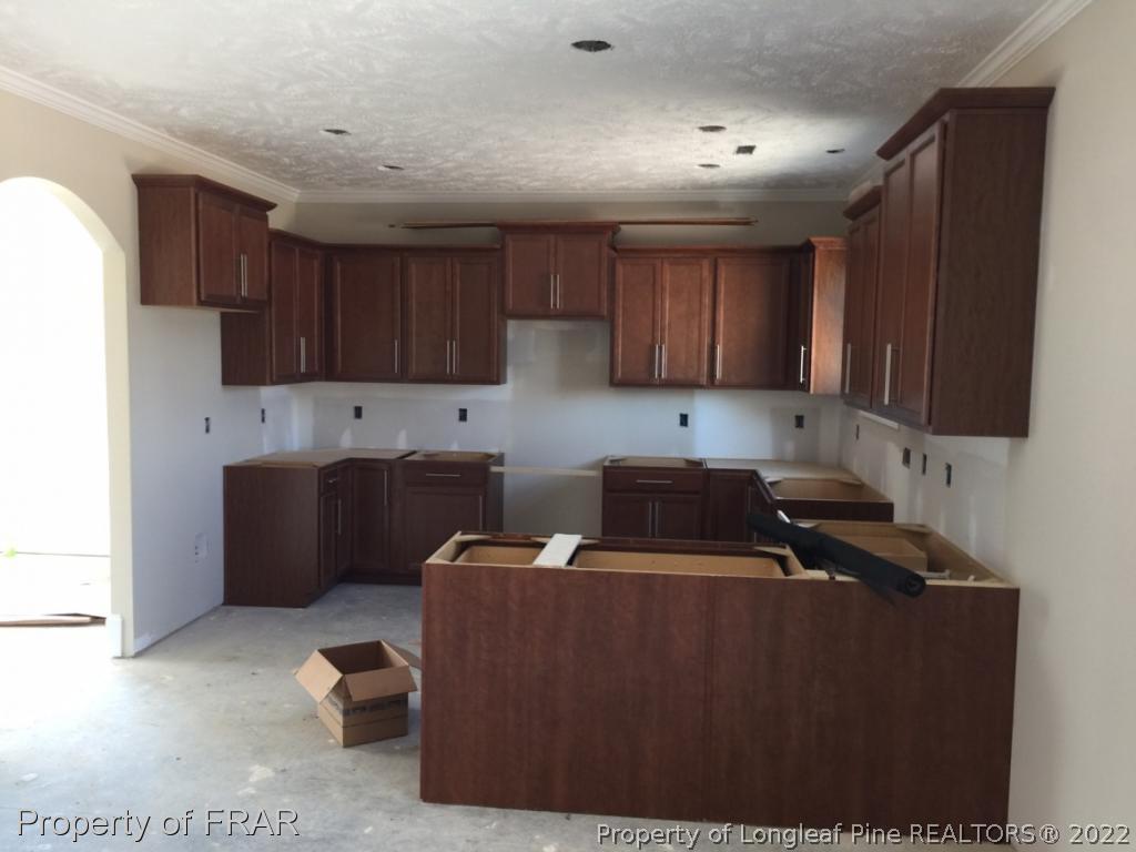 4778 McKinnon Farm Road Fayetteville, NC 28304 - Photo 6 of 18 a kitchen with a cabinets and appliances