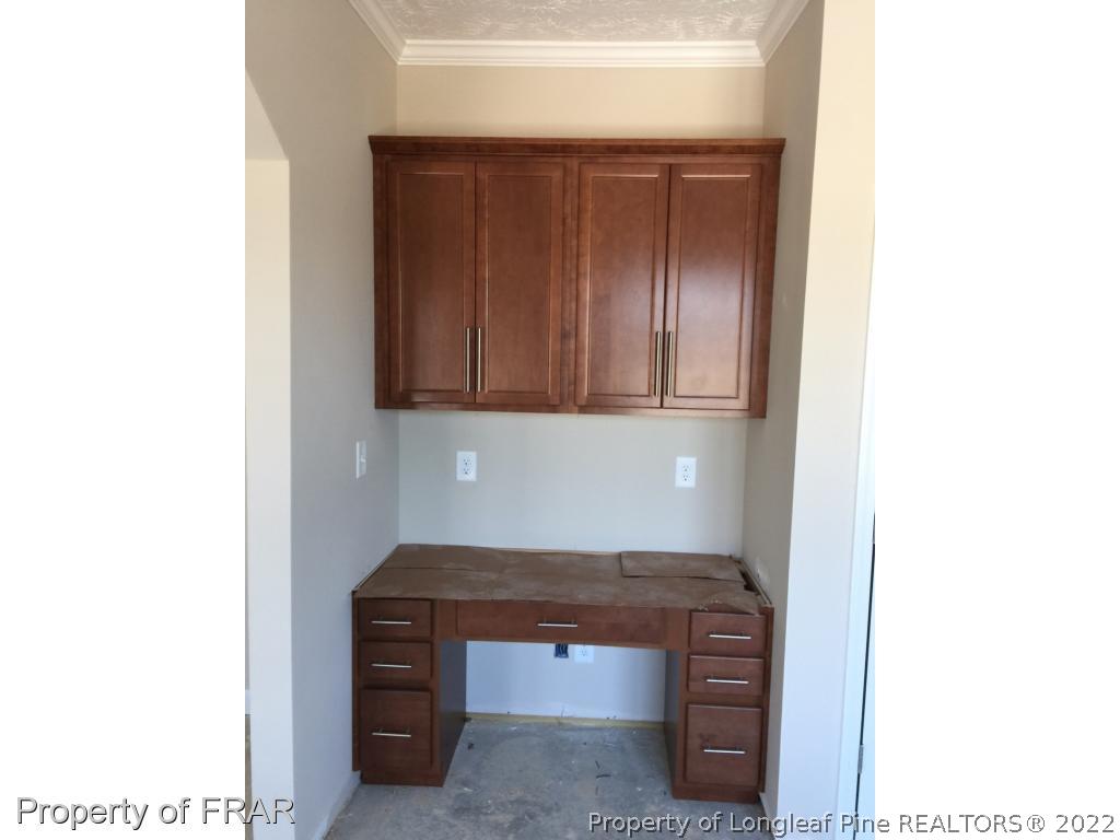 4778 McKinnon Farm Road Fayetteville, NC 28304 - Photo 8 of 18 a room with a sink and cabinets