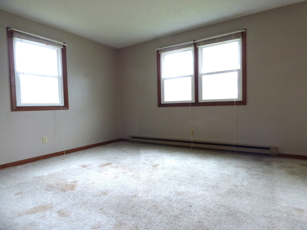 16-18 Daniel Street Springfield, MA 01151 - Photo 8 of 14 an empty room with a window