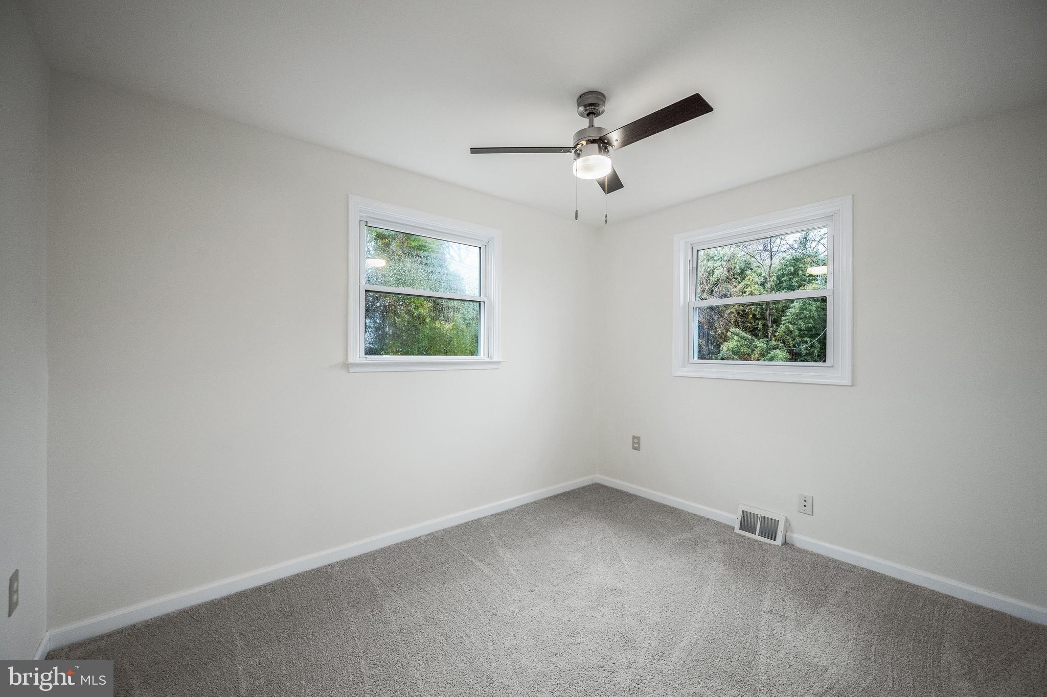 6 Mountain Road Linthicum Heights, MD 21090 - Photo 16 of 41 an empty room with a window and a fan