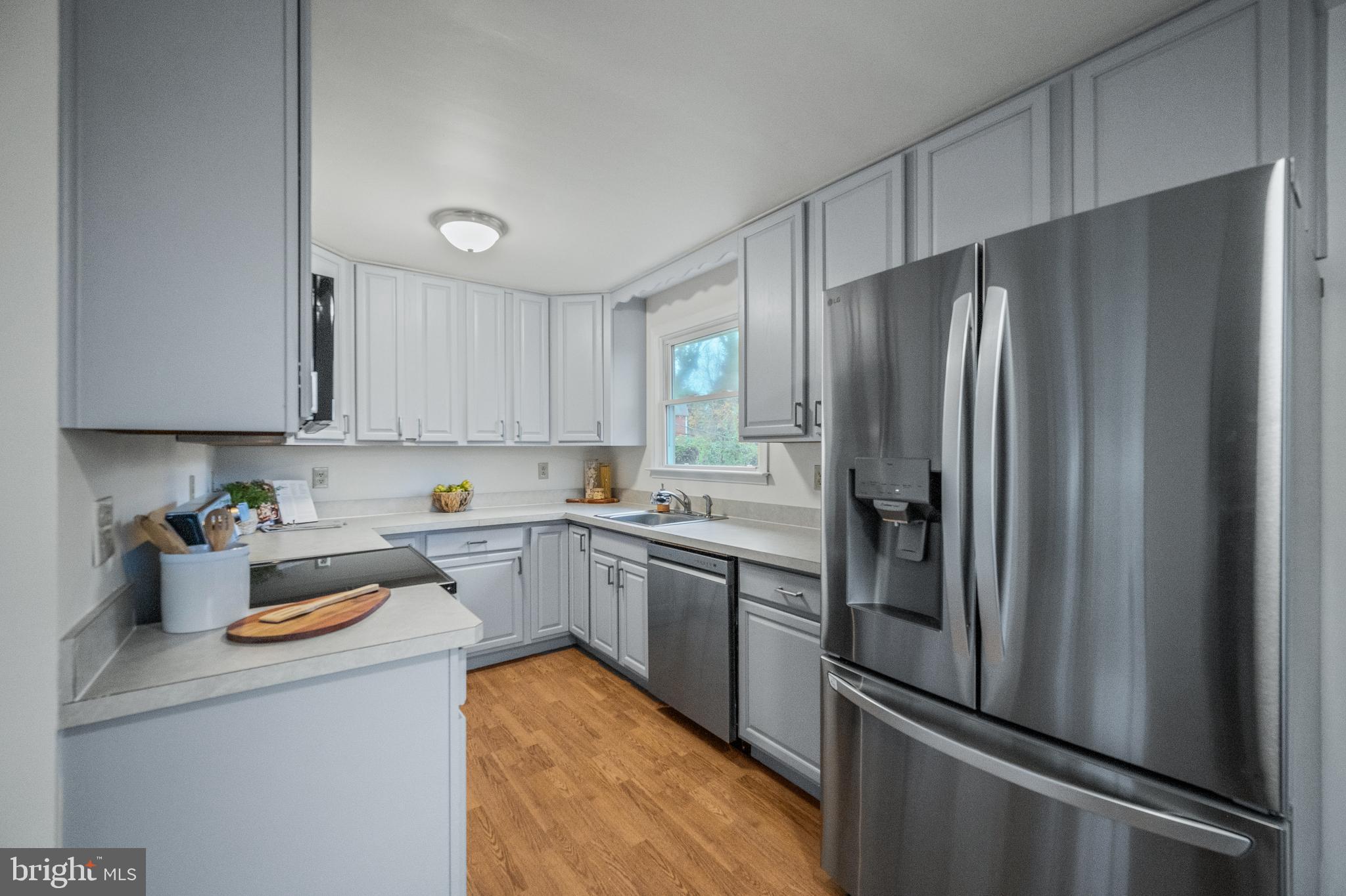 6 Mountain Road Linthicum Heights, MD 21090 - Photo 9 of 41 a kitchen with stainless steel appliances granite countertop a refrigerator and a stove