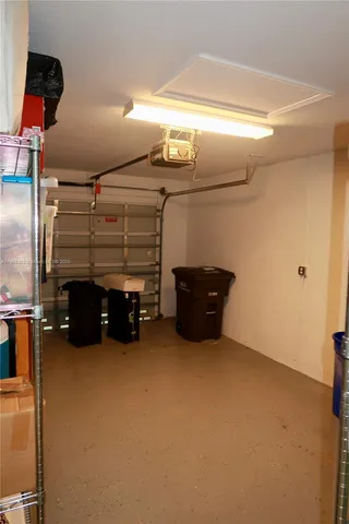 a view of room with furniture and a ceiling fan