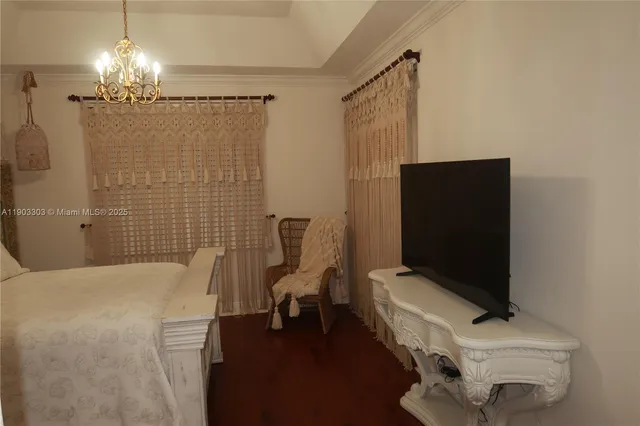 a bathroom with a sink a light fixture and a shower