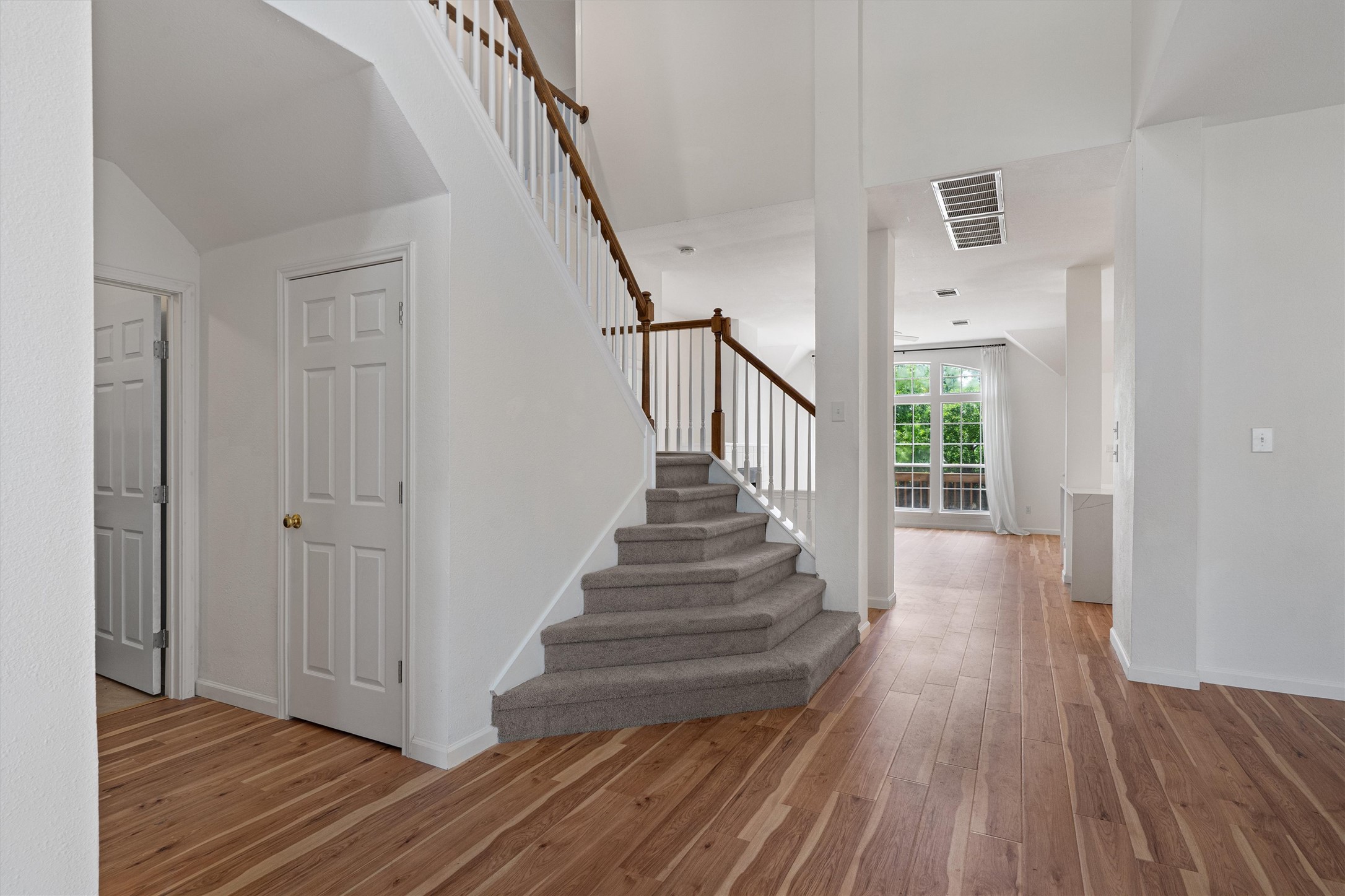 100 Parque Circle Georgetown, TX 78626 - Photo 7 of 39 a view of a hallway with wooden floor and stairs