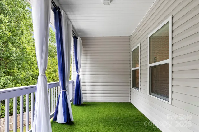 a view of a porch with a yard