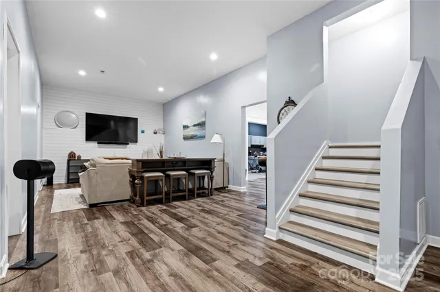 a view of a livingroom with furniture and a flat screen tv