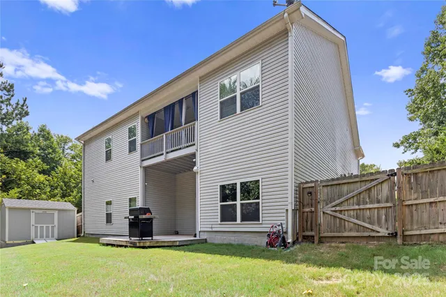 a view of a house with a outdoor space and sitting area