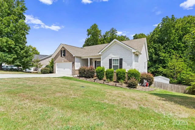 a view of a backyard with a small cabin