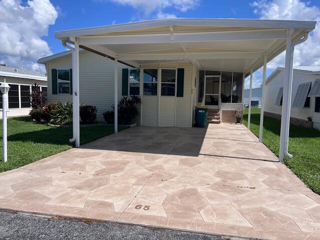 a view of a patio with table and chairs with wooden floor and fence