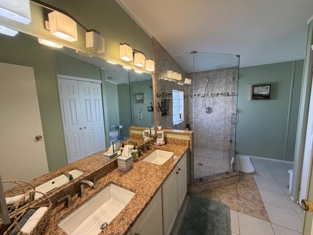 65 Turquoise Avenue Naples, FL 34114 - Photo 30 of 34 a bathroom with a granite countertop sink and a mirror