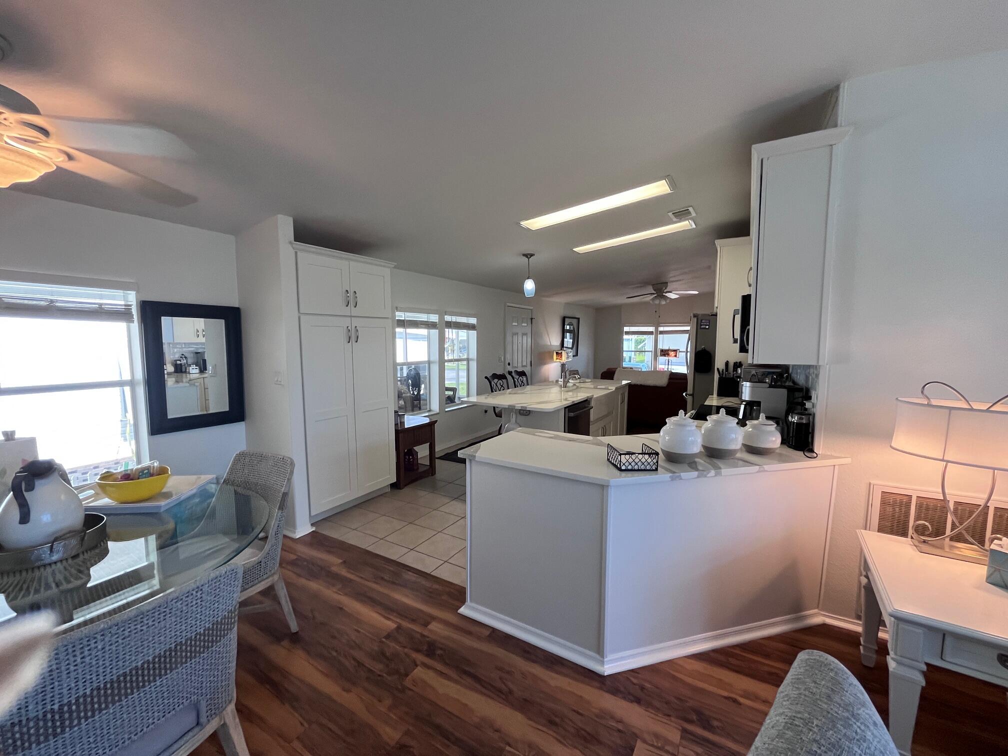 65 Turquoise Avenue Naples, FL 34114 - Photo 8 of 34 a view of kitchen with dining table and chairs