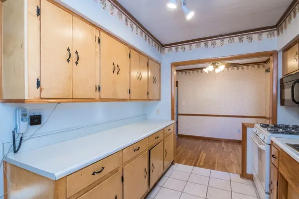 a kitchen with stainless steel appliances a cabinets and a counter top space
