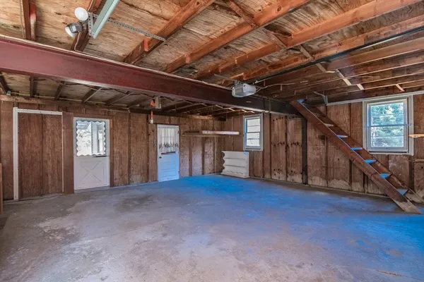 a view of an empty room with wooden roof