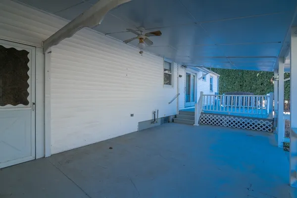 a view of a porch with a bench