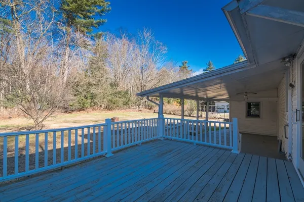 a view of a porch with wooden floor