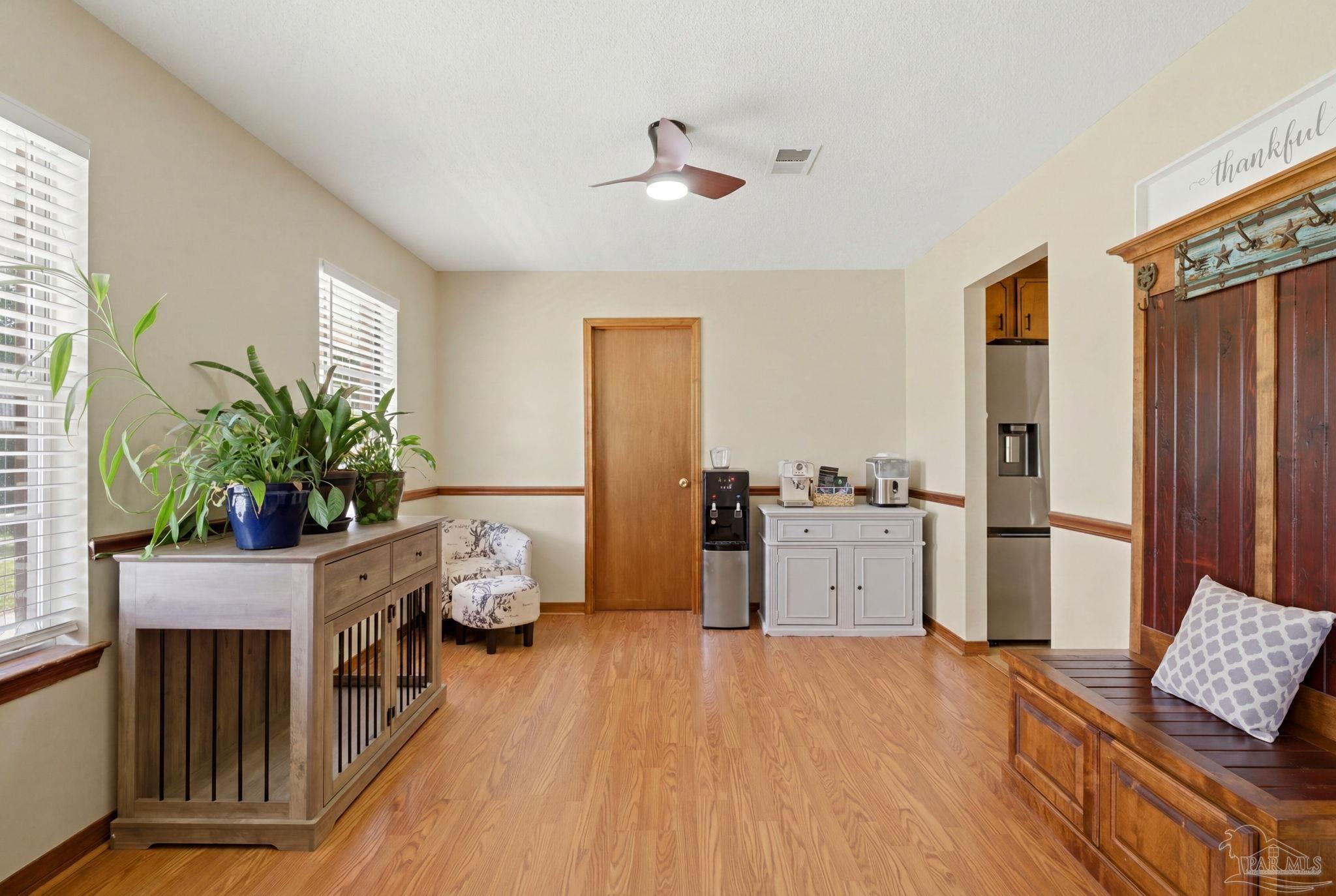 6870 Martin Road Milton, FL 32570 - Photo 6 of 48 a room with furniture and a window