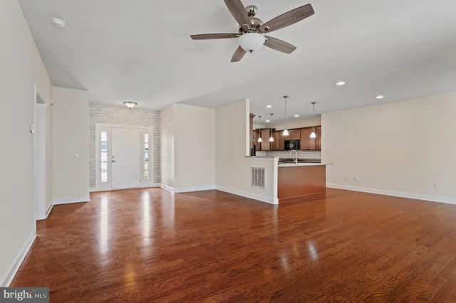 a view of a kitchen with a sink and a stove