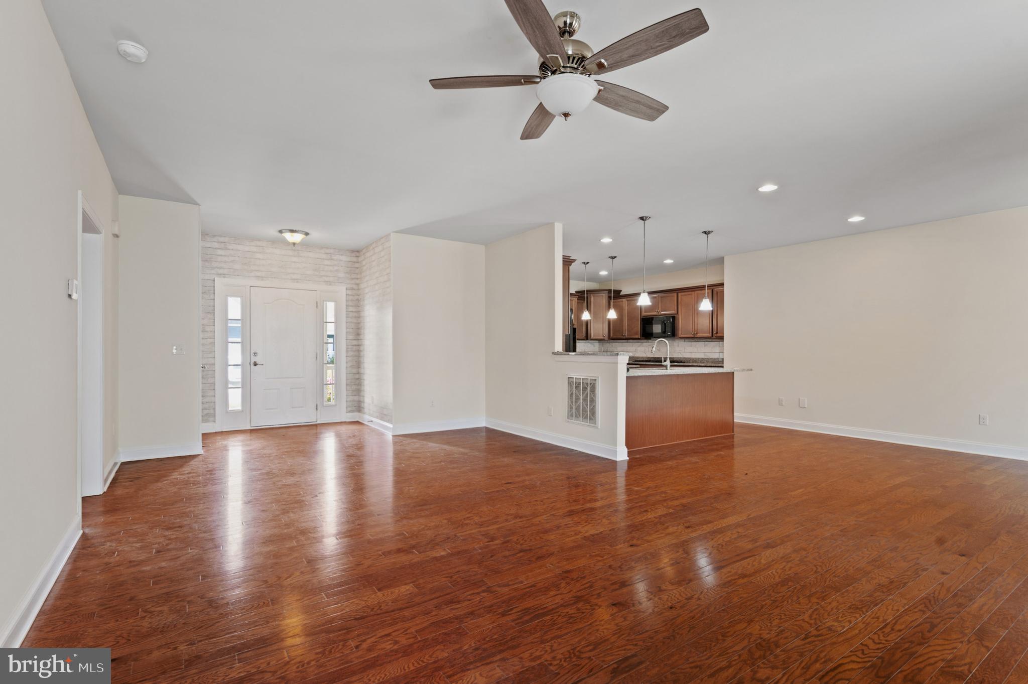 33301 Bayberry Court Dagsboro, DE 19939 - Photo 11 of 44 a view of a kitchen with a sink and a stove