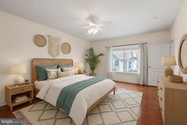 a bedroom with a large bed and a window