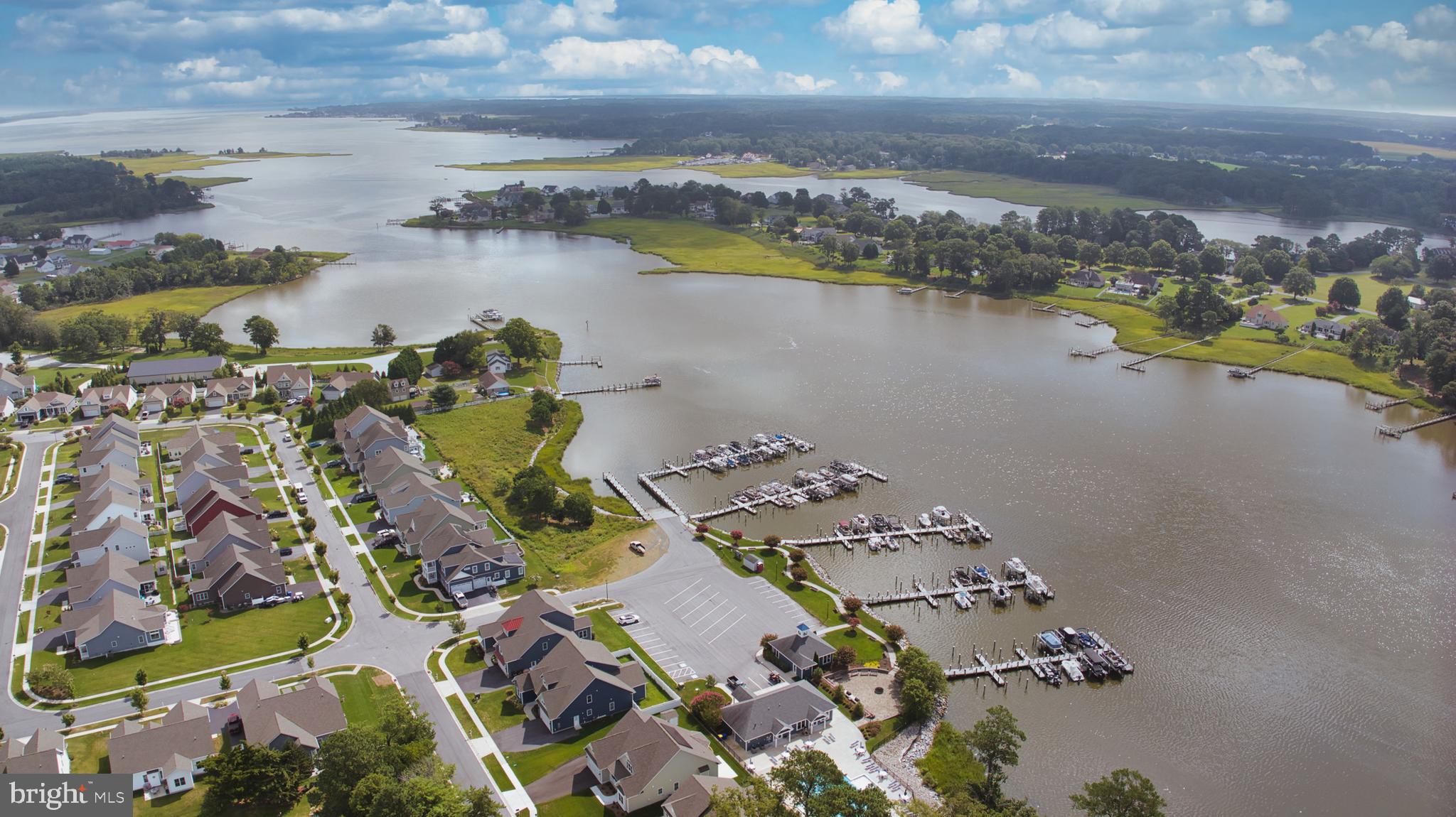 33301 Bayberry Court Dagsboro, DE 19939 - Photo 2 of 44 an aerial view of a city with lake view
