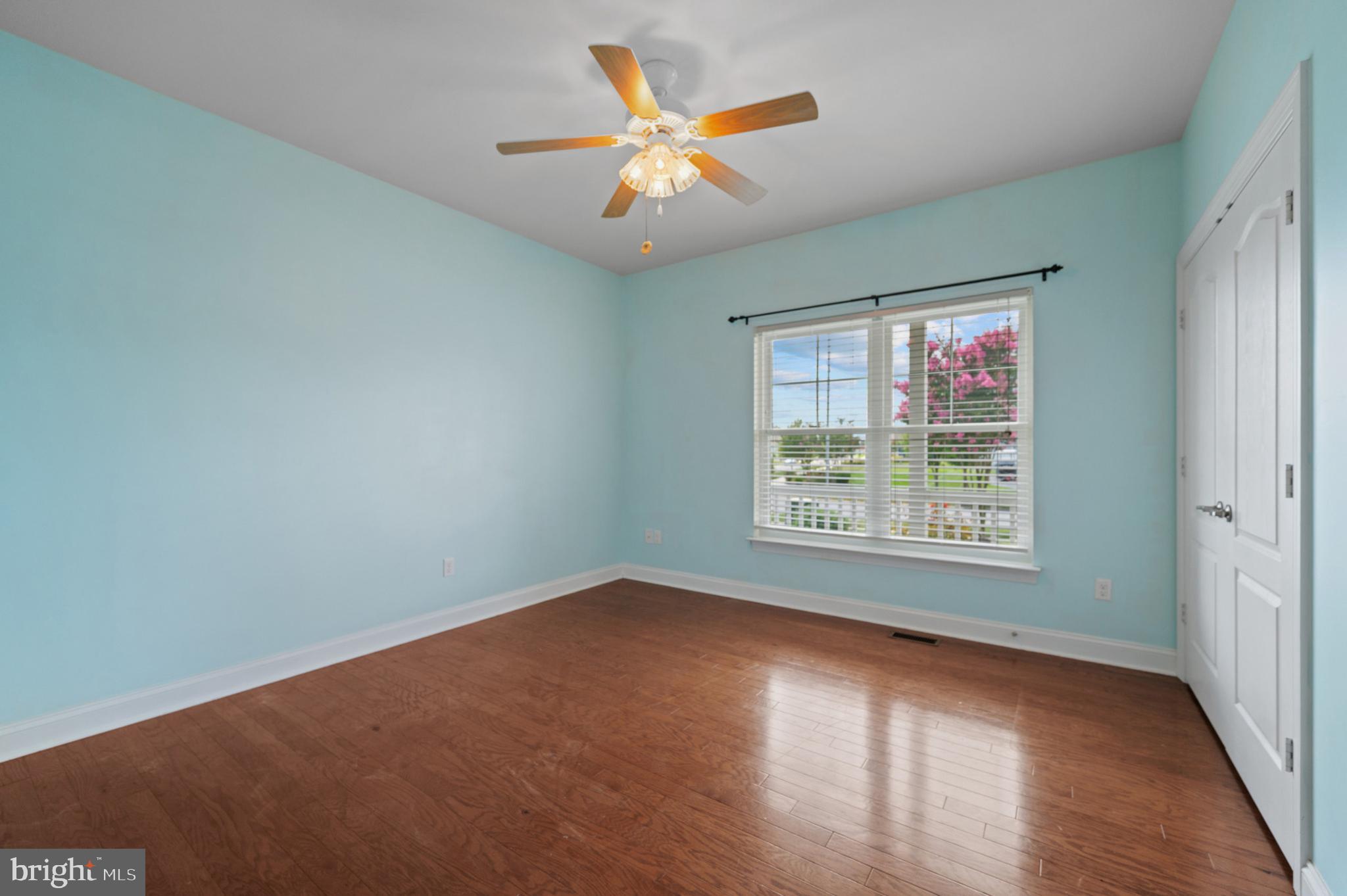 33301 Bayberry Court Dagsboro, DE 19939 - Photo 24 of 44 an empty room with wooden floor and windows