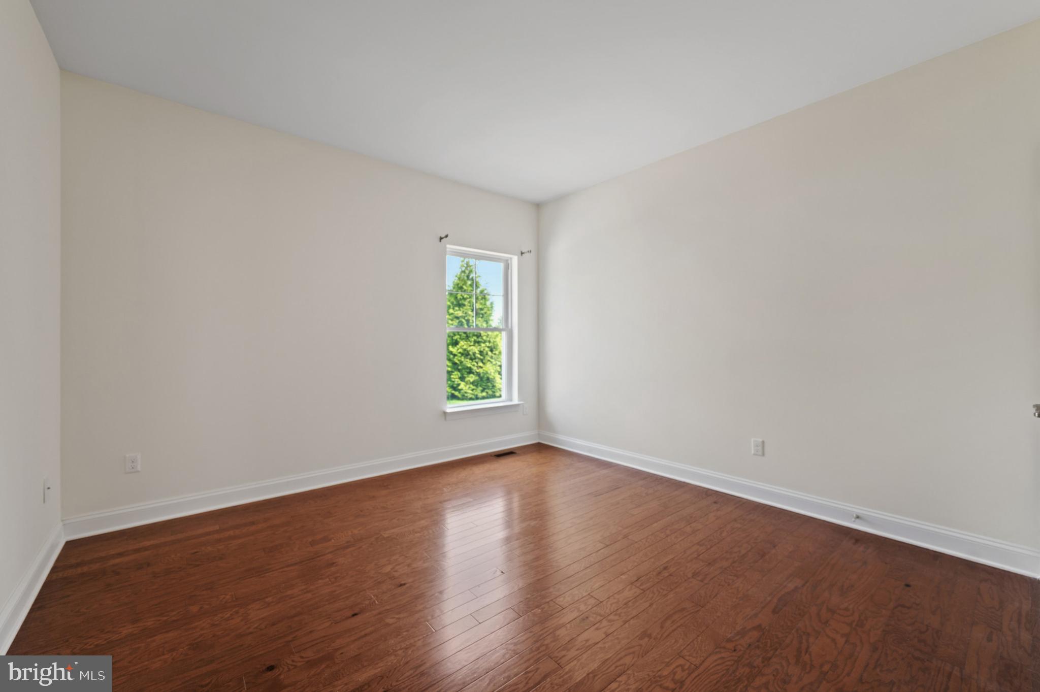 33301 Bayberry Court Dagsboro, DE 19939 - Photo 26 of 44 an empty room with wooden floor and window