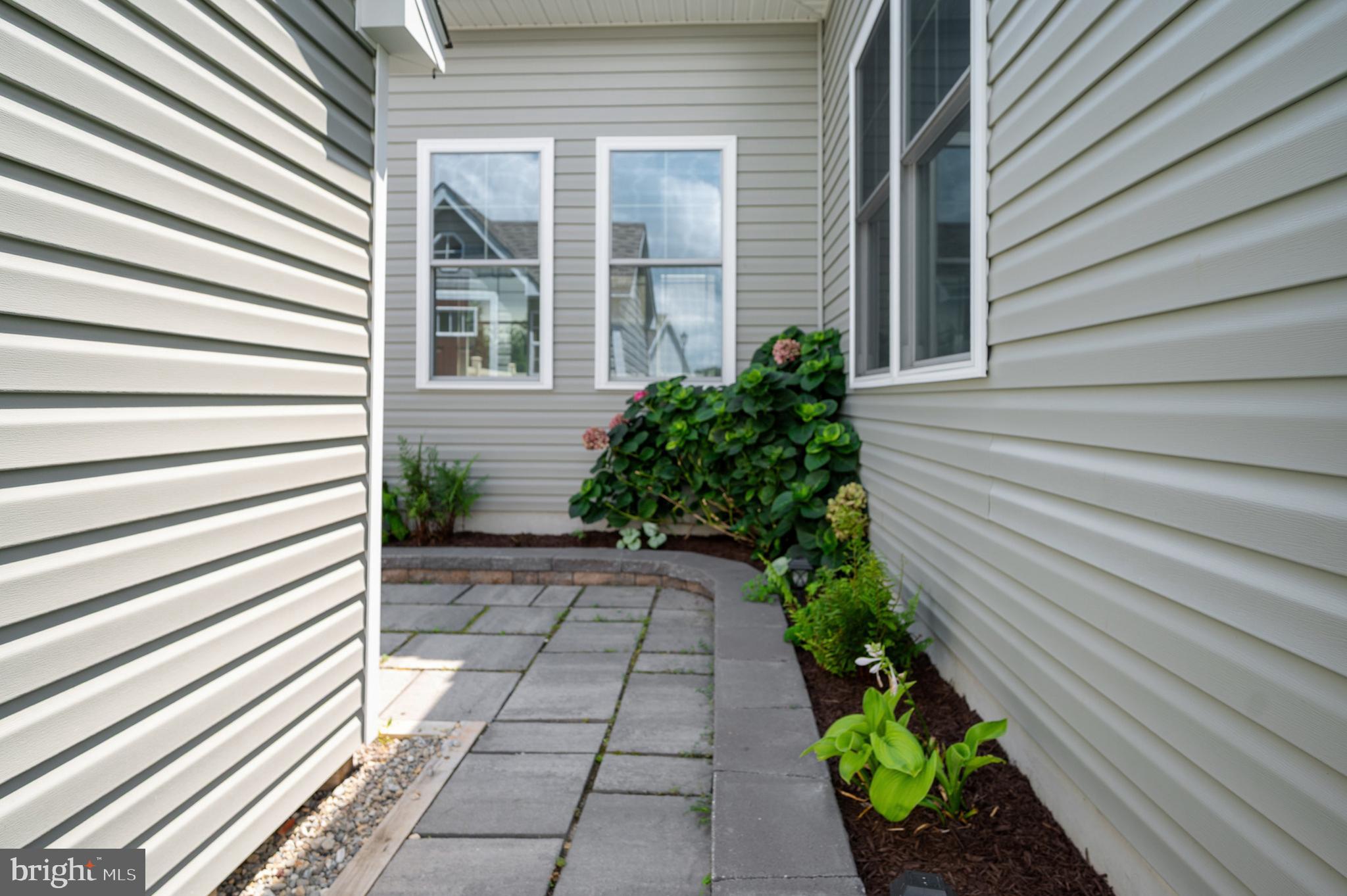 33301 Bayberry Court Dagsboro, DE 19939 - Photo 27 of 44 a view of a pathway with a flower