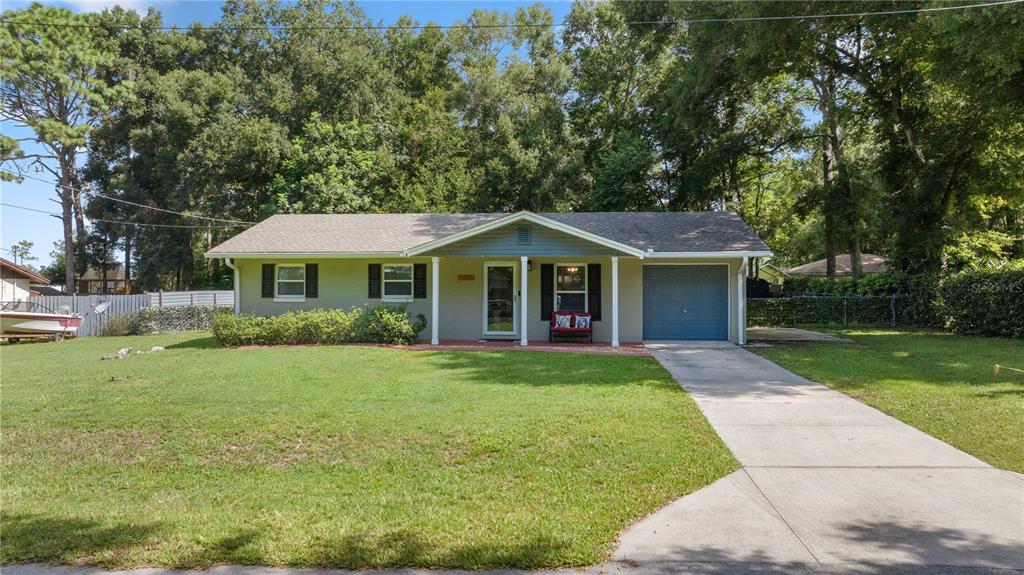 7527 Southwest 78th Street Ocala, FL 34476 - Photo 1 of 1 a front view of a house with a yard