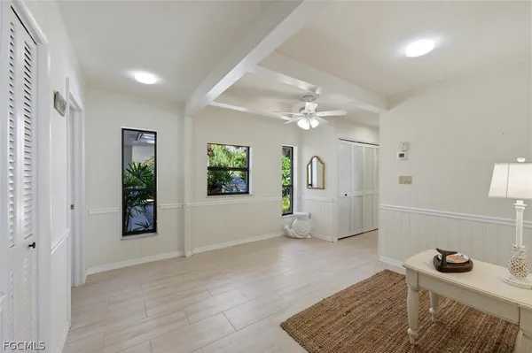 a bedroom with furniture and window