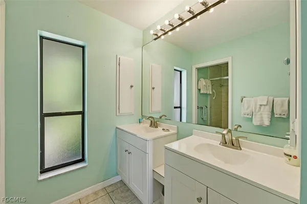 a bathroom with a sink and mirror