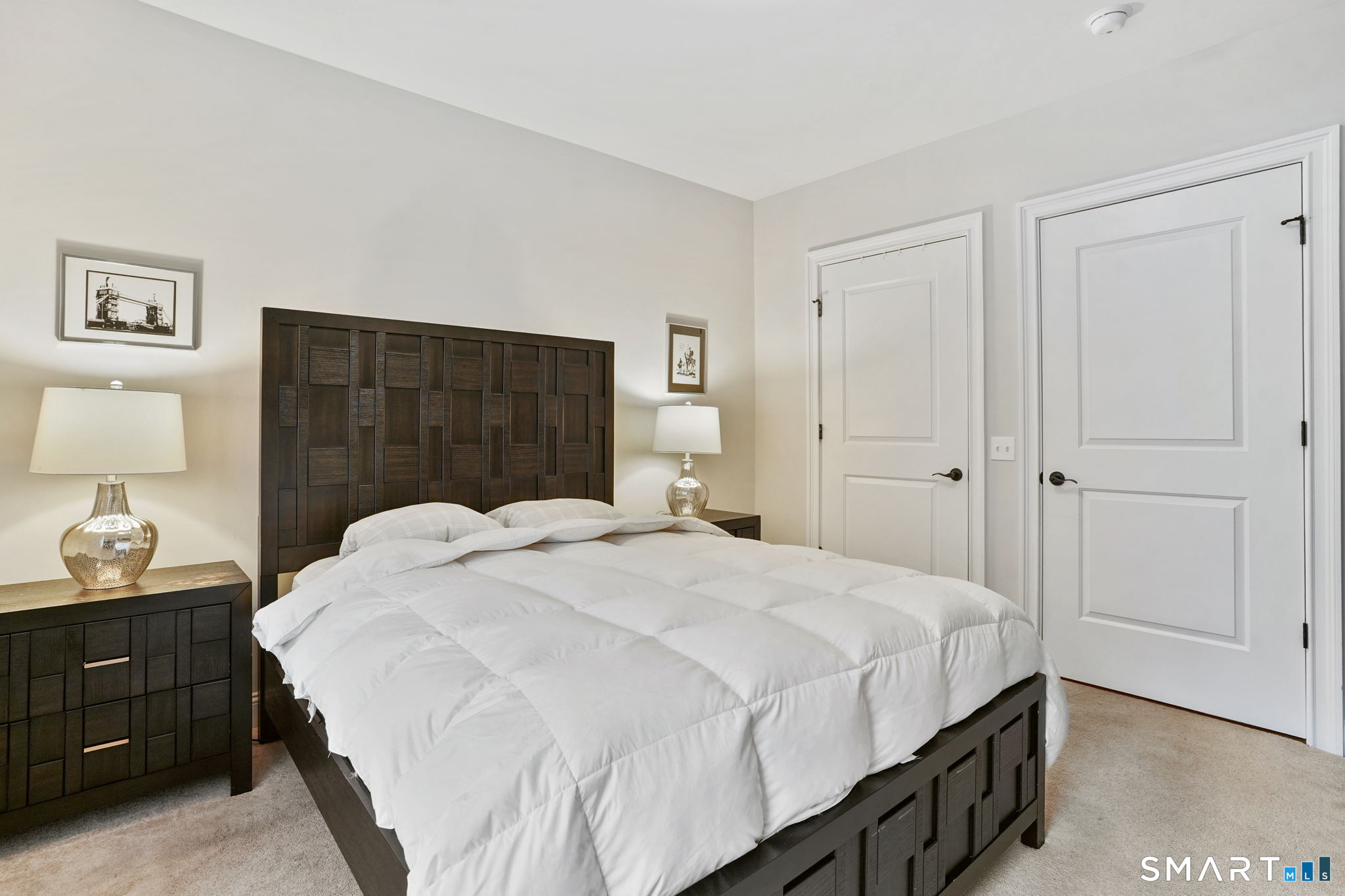 233 Danbury Road, Unit A209 Ridgefield, CT 06877 - Photo 12 of 25 a bedroom with a bed and a closet