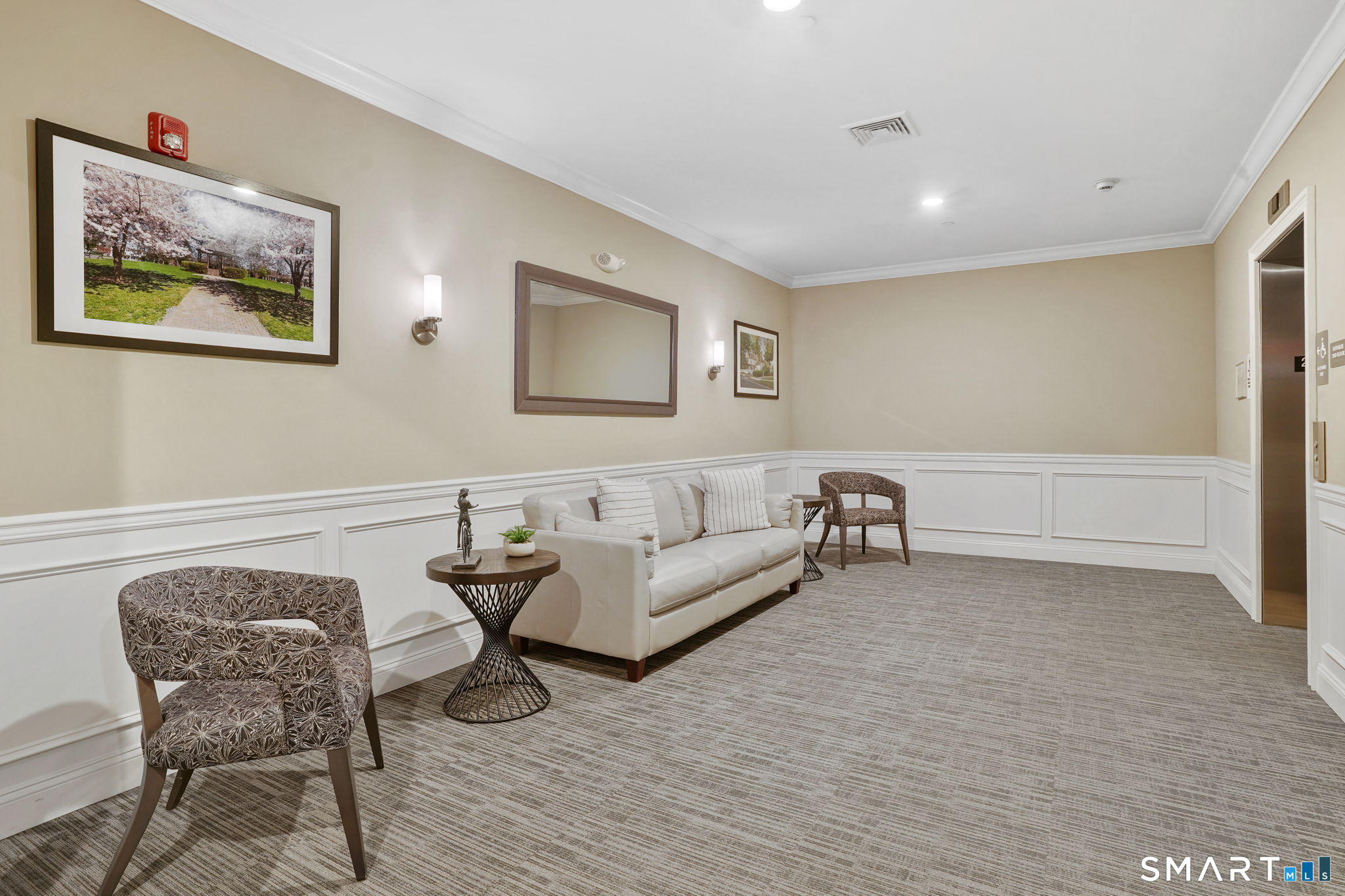 233 Danbury Road, Unit A209 Ridgefield, CT 06877 - Photo 20 of 25 a living room with furniture and a wooden floor