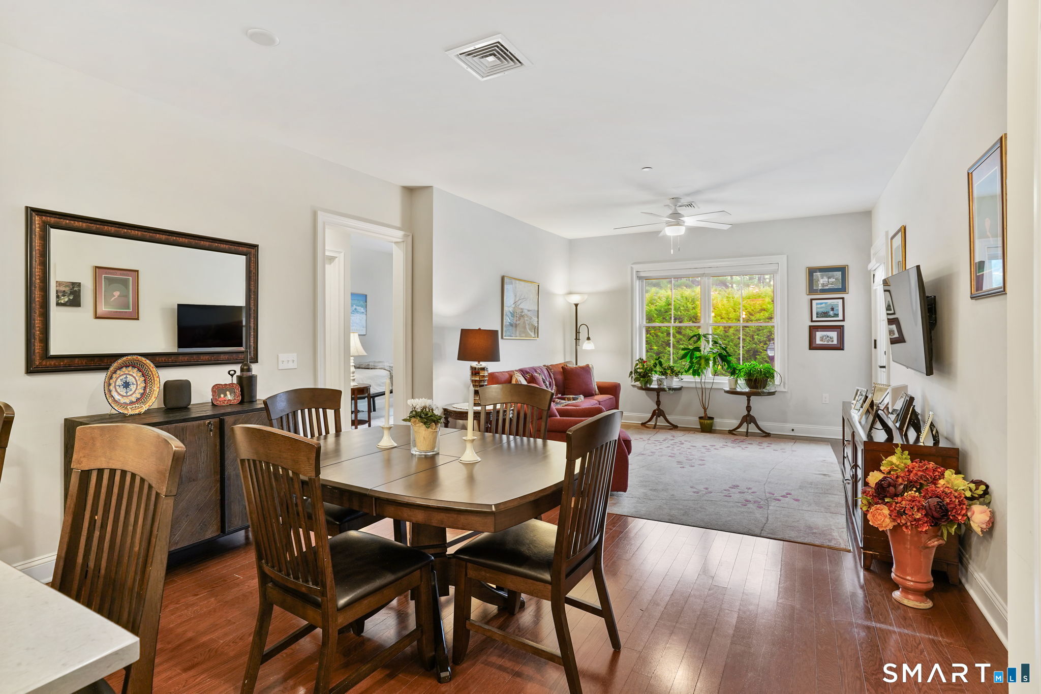 233 Danbury Road, Unit A209 Ridgefield, CT 06877 - Photo 7 of 25 a view of a dining room with furniture and a livingroom