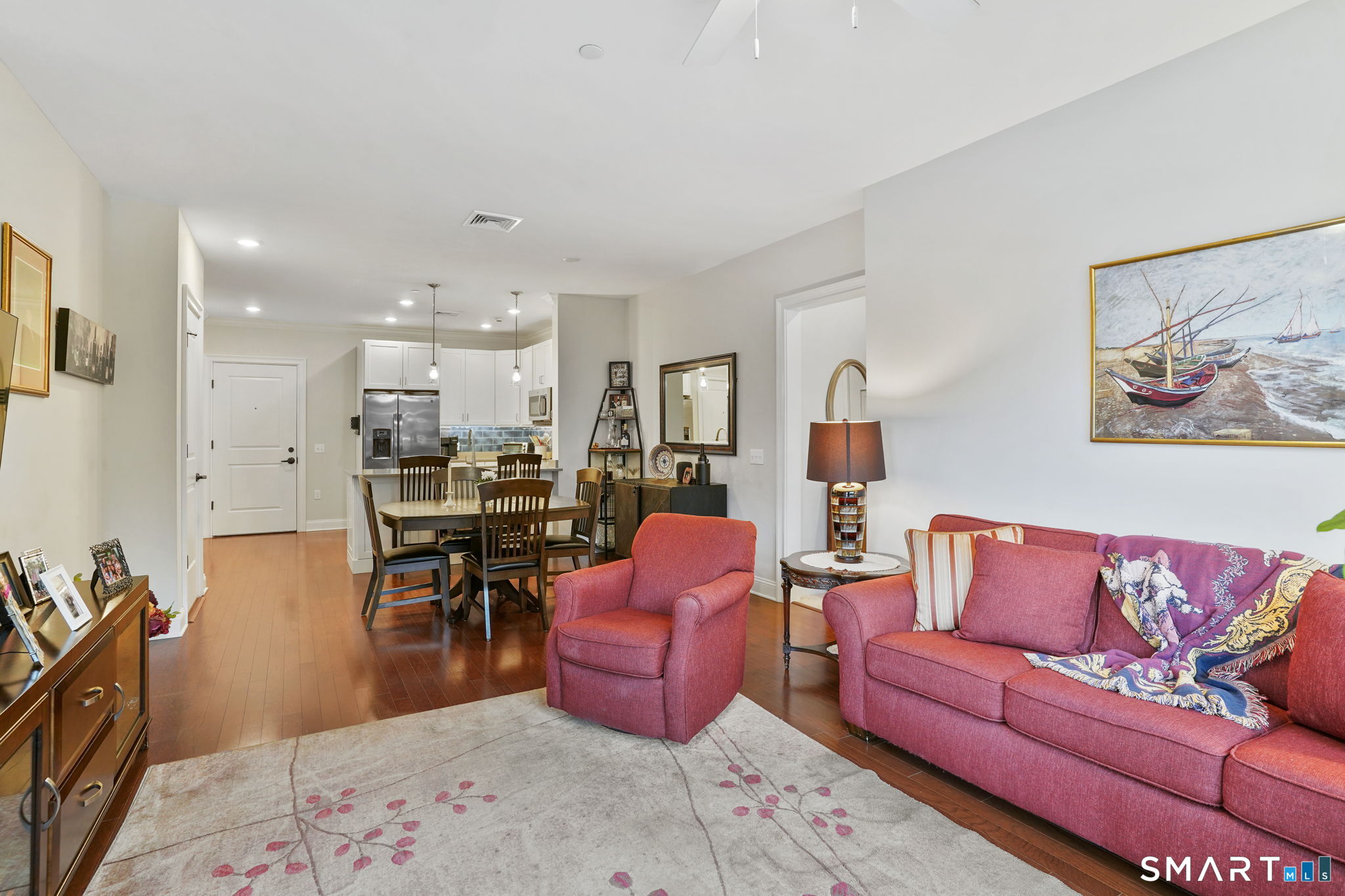 233 Danbury Road, Unit A209 Ridgefield, CT 06877 - Photo 8 of 25 a living room with furniture a couch and kitchen view